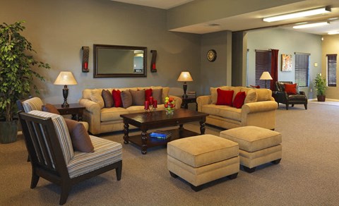 a living room with couches and chairs